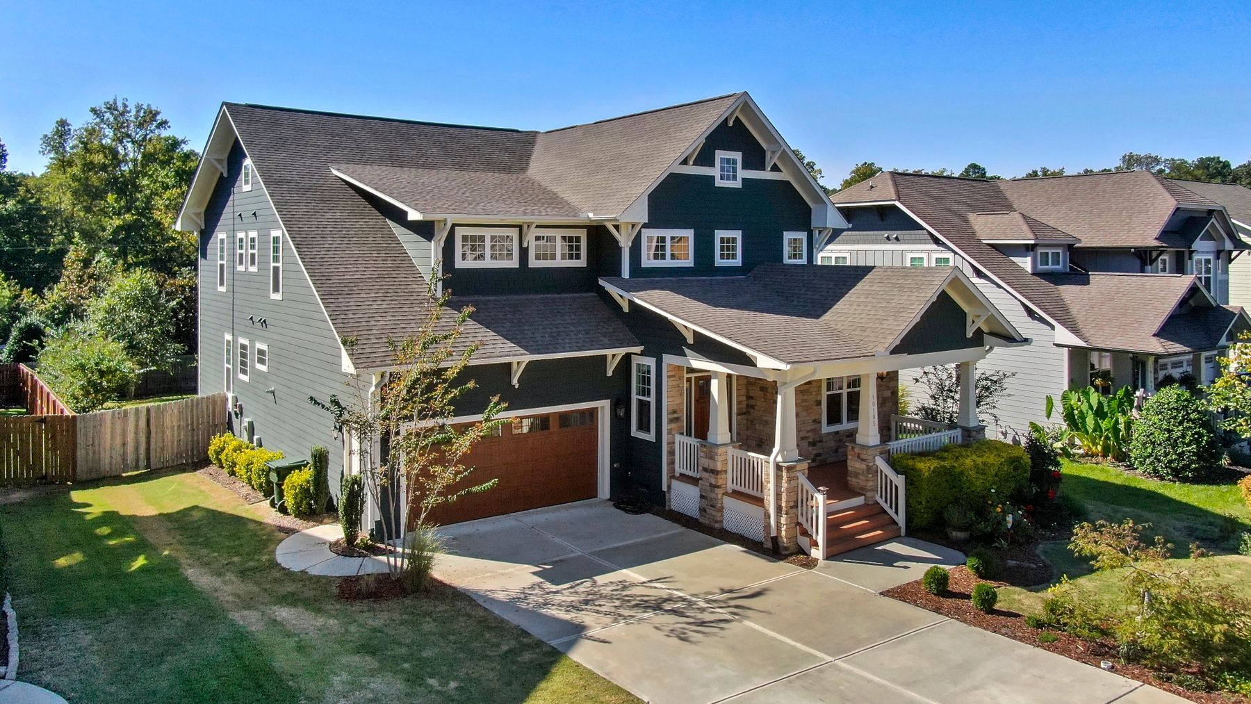 A craftsman-style house with bay windows
