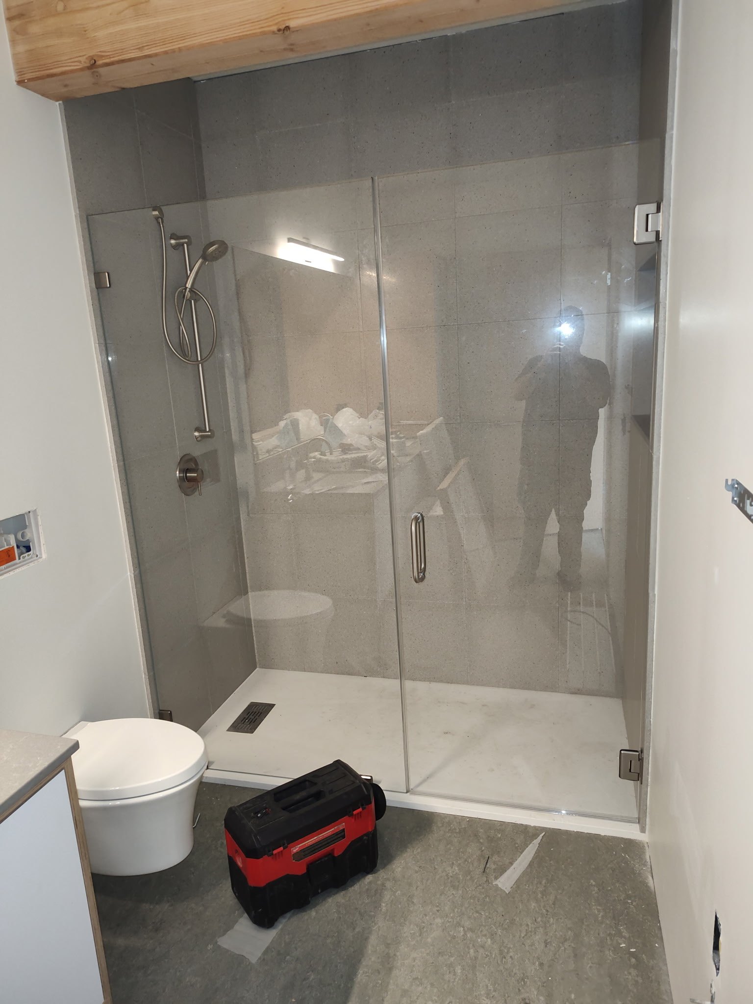 A frameless shower enclosure the crew installed